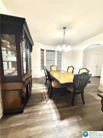 a view of a livingroom with furniture window and wooden floor