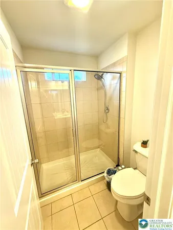 a spacious bathroom with a granite countertop sink mirror and a