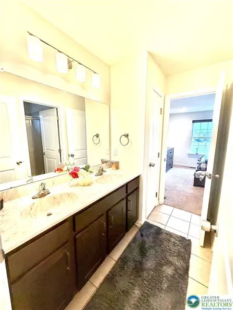 a bedroom with a bed and a cabinets