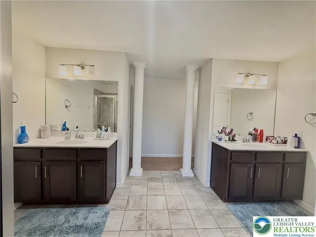 a bathroom with a bathtub and shower