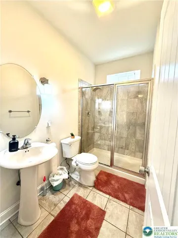 a room with furniture and air conditioner vent