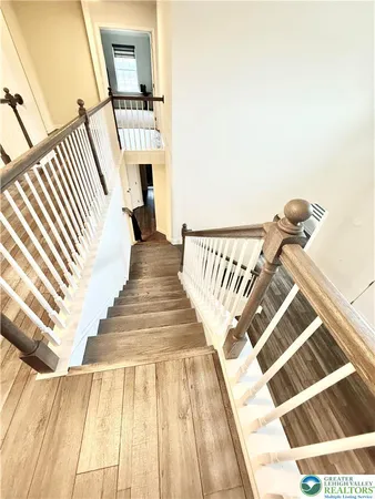 a view of an empty room and wooden floor