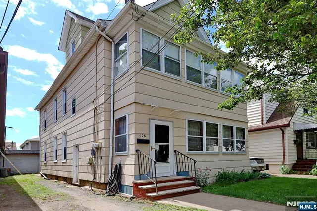 a view of house with yard