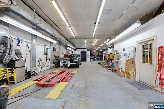 a view of parking garage with cars