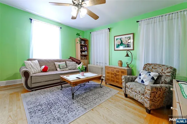 a living room with furniture and a rug