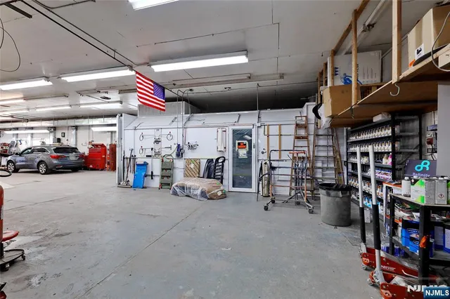 a view of parking garage with cars