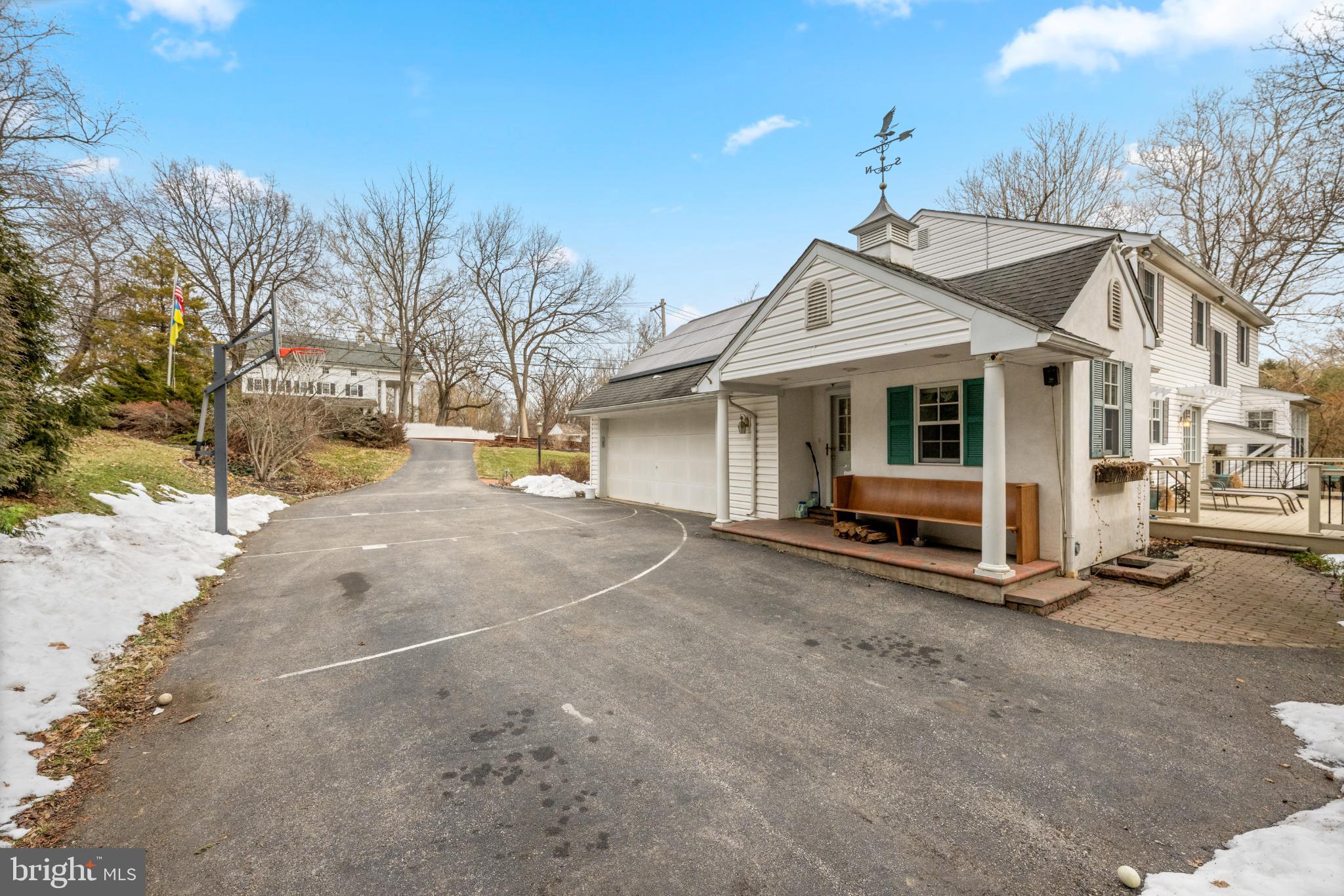 714 Gulph Road Wayne, PA 19087 - Photo 3 of 49 Charming home with inviting driveway and greenery.