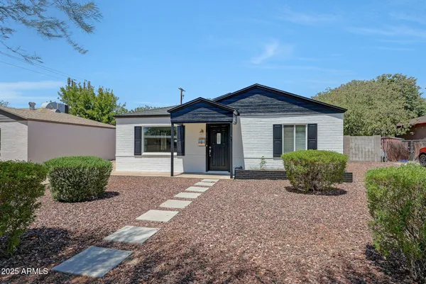 front view of a house with a yard