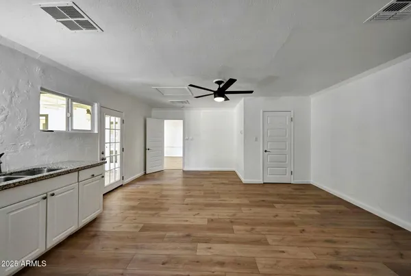 a view of a kitchen with a sink and cabinet area