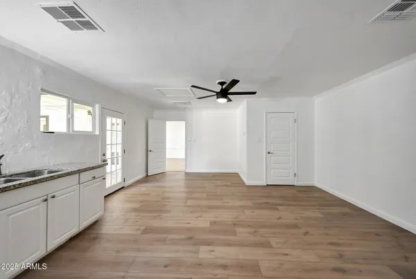a view of a kitchen with a sink and cabinet area