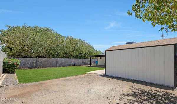 a view of a backyard with a garden