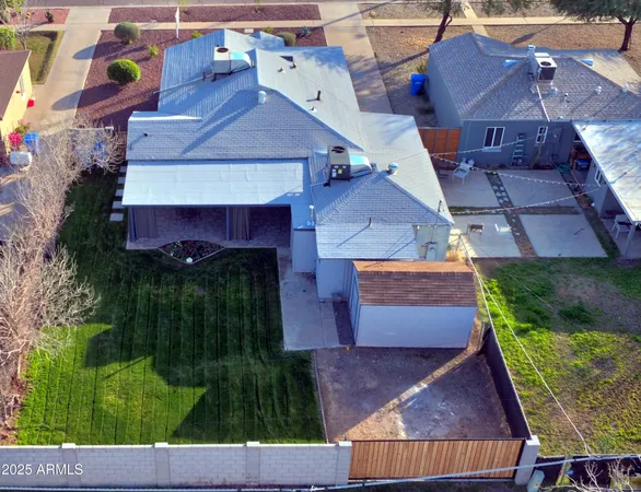 an aerial view of houses with yard