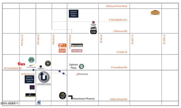 a cabinet with a white cabinet and a picture on the wall