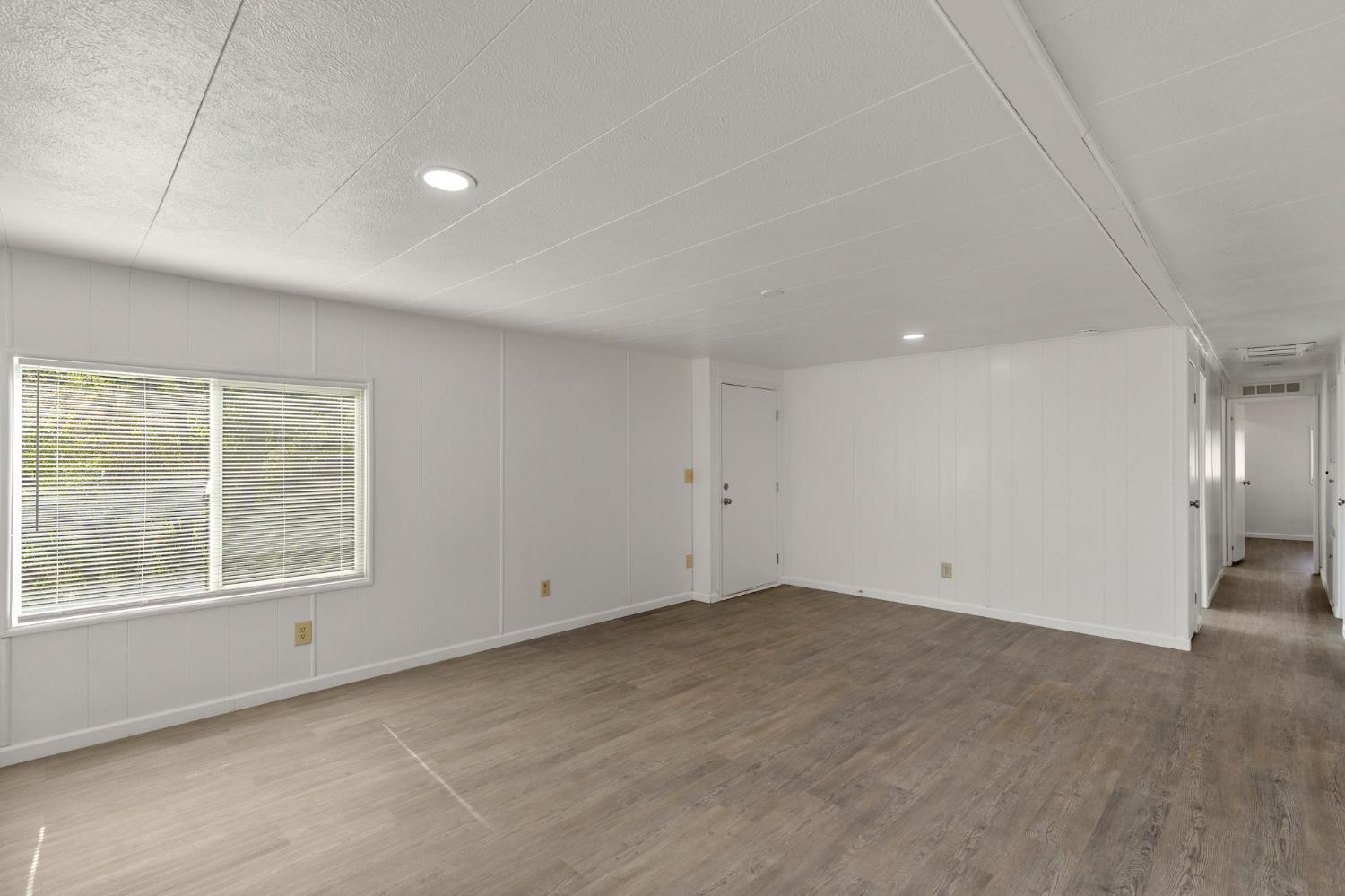 10155 Peppermint Circle, Unit 35 Jamestown, CA 95327 - Photo 11 of 27 an empty room with a empty space and window