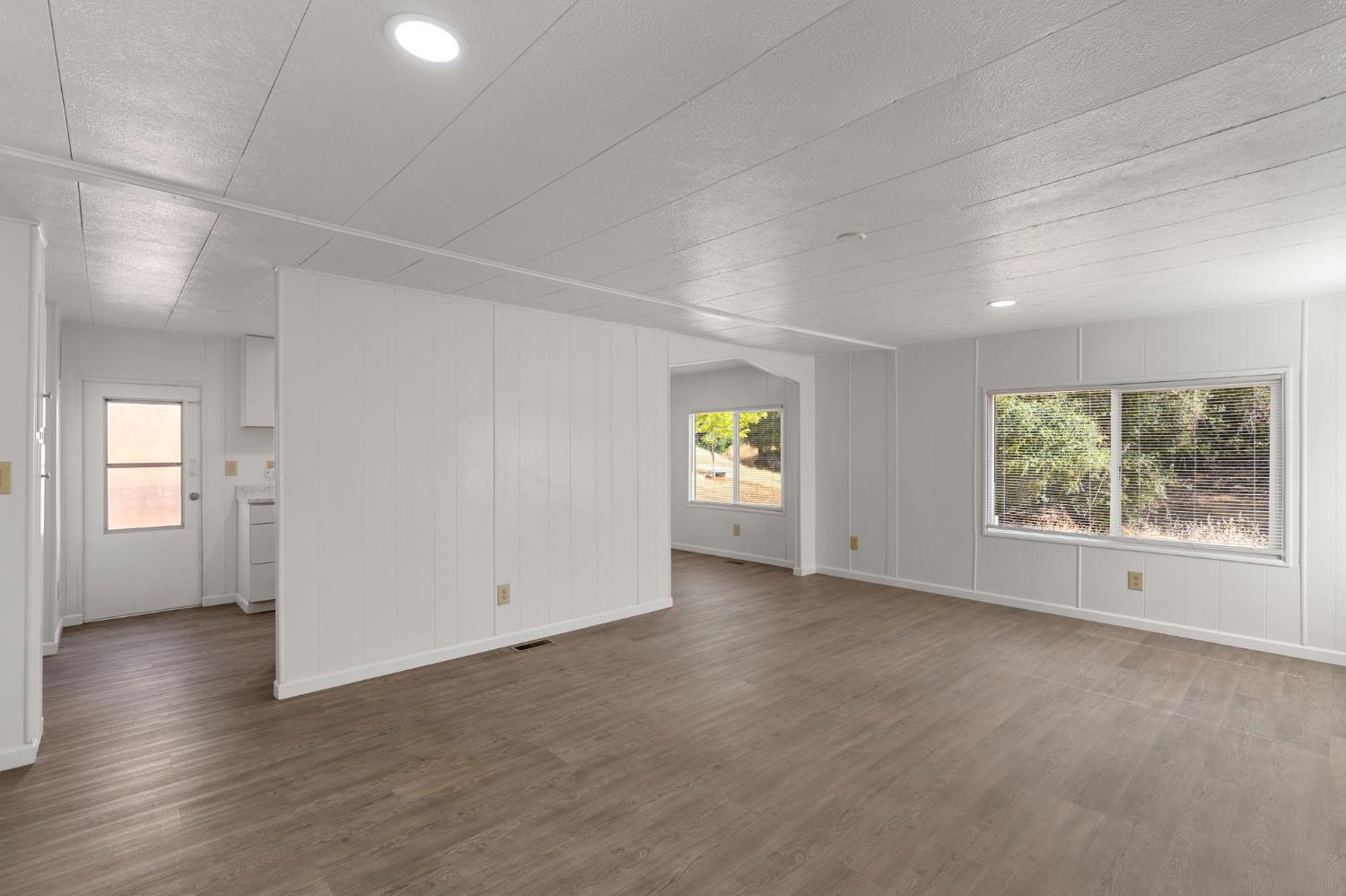 10155 Peppermint Circle, Unit 35 Jamestown, CA 95327 - Photo 13 of 27 an empty room with windows