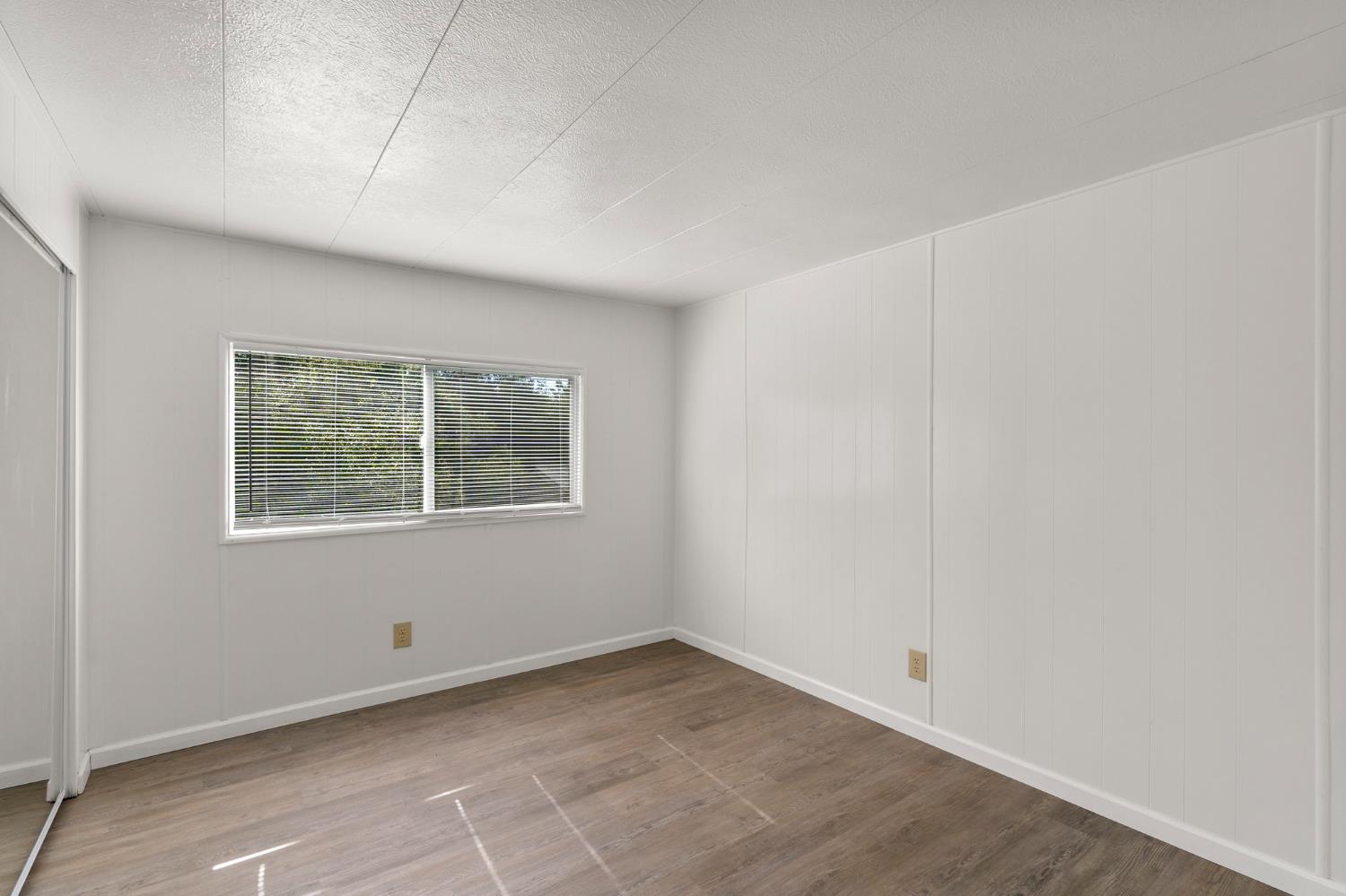 10155 Peppermint Circle, Unit 35 Jamestown, CA 95327 - Photo 16 of 27 an empty room with a window