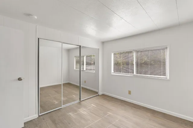 a view of an empty room with a window