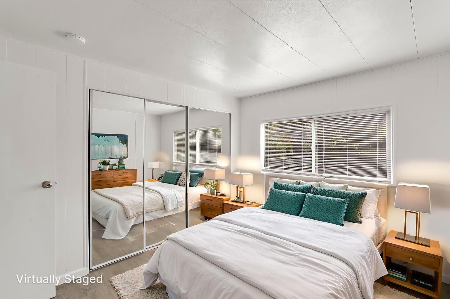 10155 Peppermint Circle, Unit 35 Jamestown, CA 95327 - Photo 19 of 27 a bedroom with two beds and large windows