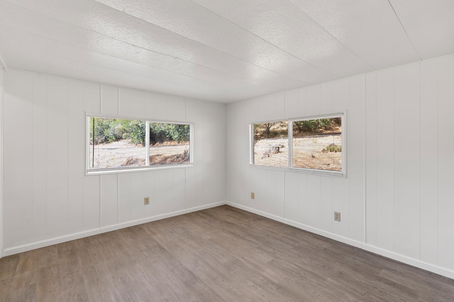 10155 Peppermint Circle, Unit 35 Jamestown, CA 95327 - Photo 20 of 27 an empty room with windows