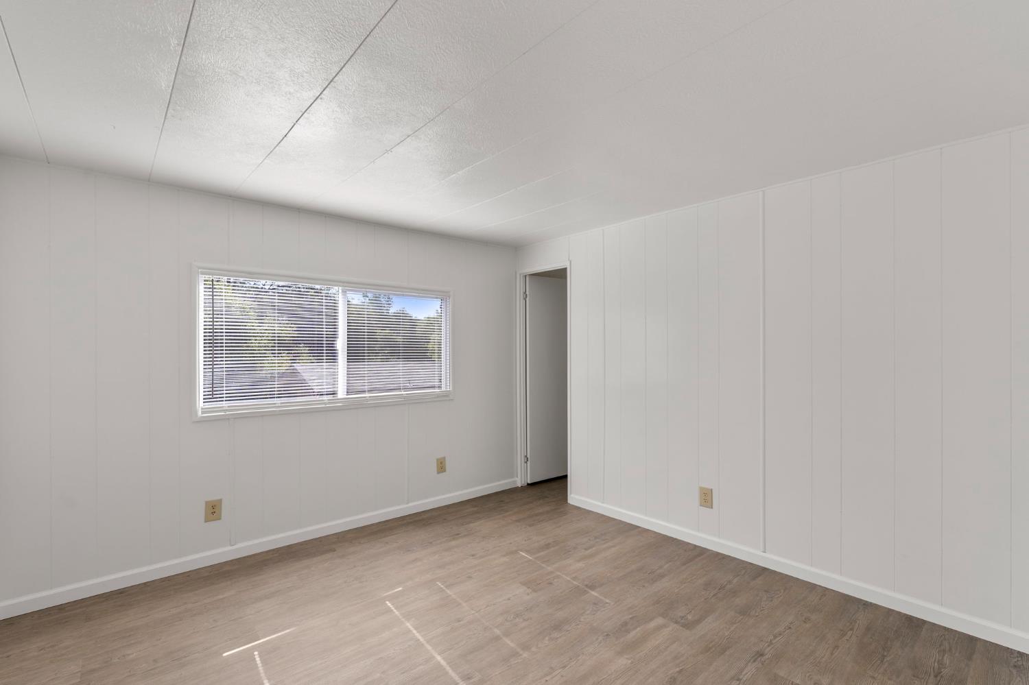 10155 Peppermint Circle, Unit 35 Jamestown, CA 95327 - Photo 24 of 27 an empty room with a window