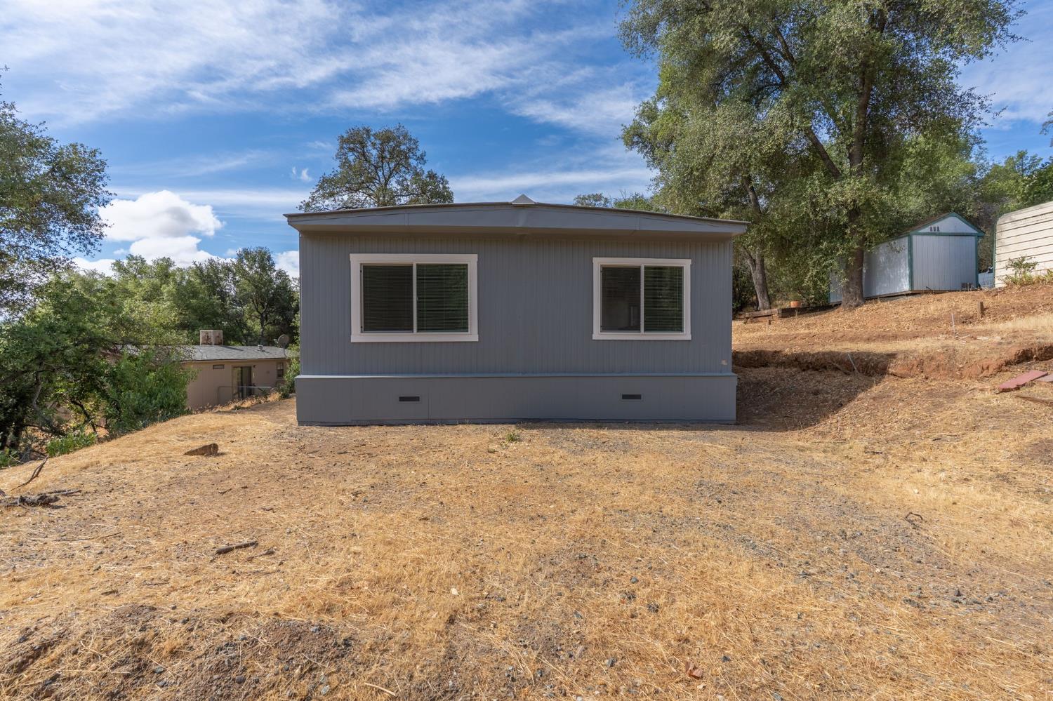 10155 Peppermint Circle, Unit 35 Jamestown, CA 95327 - Photo 27 of 27 a view of a house with a yard