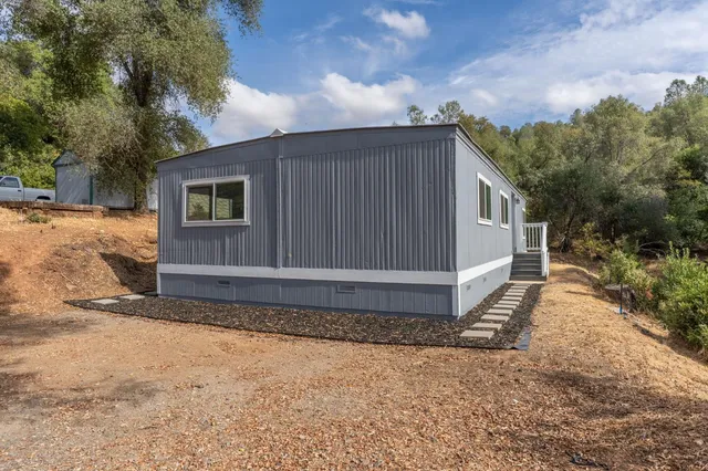 a house view with a backyard space