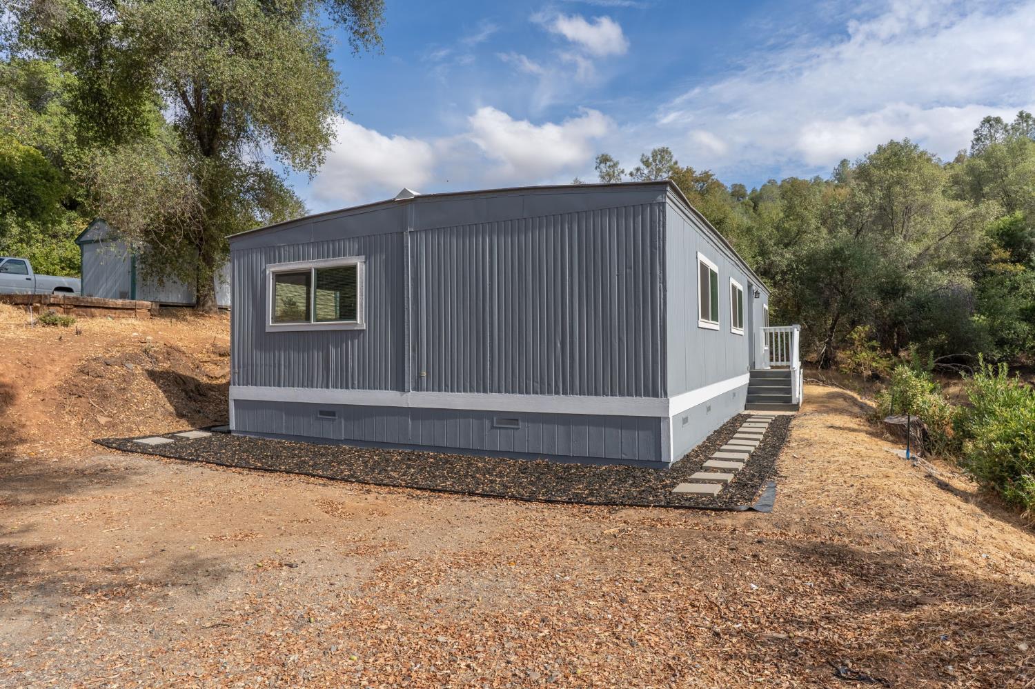 10155 Peppermint Circle, Unit 35 Jamestown, CA 95327 - Photo 3 of 27 a house view with a backyard space