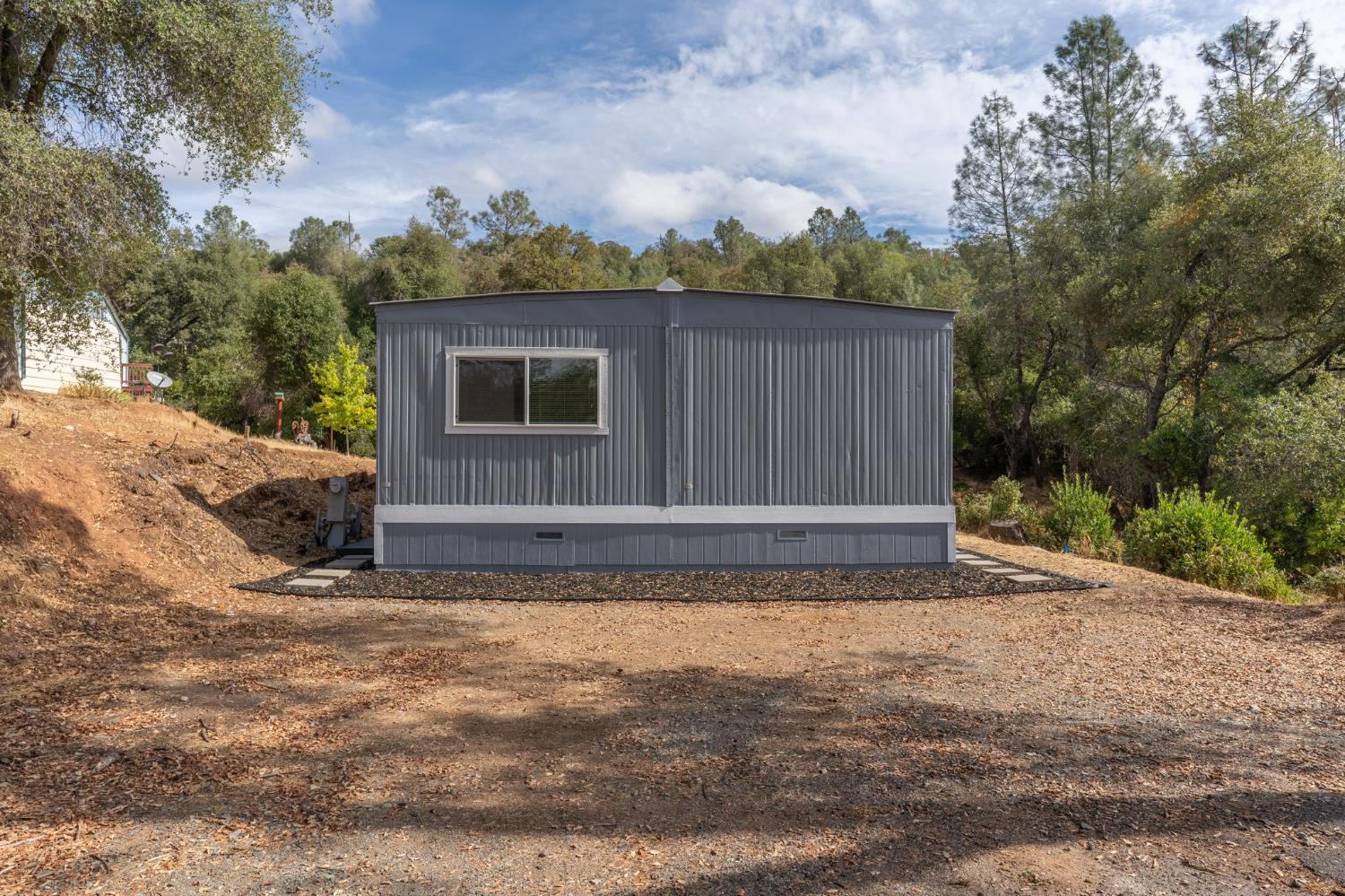 10155 Peppermint Circle, Unit 35 Jamestown, CA 95327 - Photo 4 of 27 a view of backyard with cabin