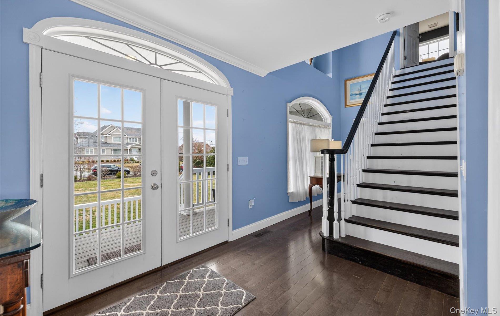 108 Awixa Avenue Bay Shore, NY 11706 - Photo 11 of 47 Entryway with hardwood / wood-style floors, crown molding, and french doors
