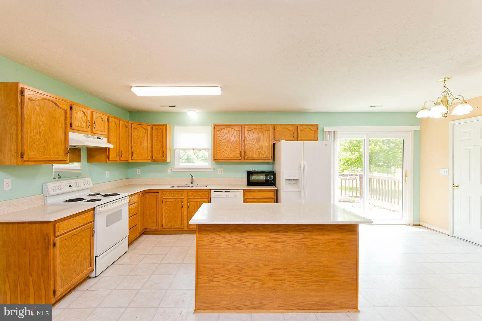 88 Howellsville Road Front Royal, VA 22630 - Photo 9 of 43 Kitchen with Island and slider to the deck