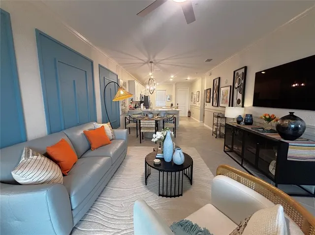 a living room with furniture and a lamp