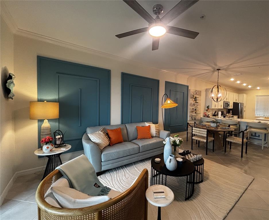 12140 Wellen Golf Street, Unit 404 Venice, FL 34293 - Photo 14 of 55 a living room with furniture and a lamp