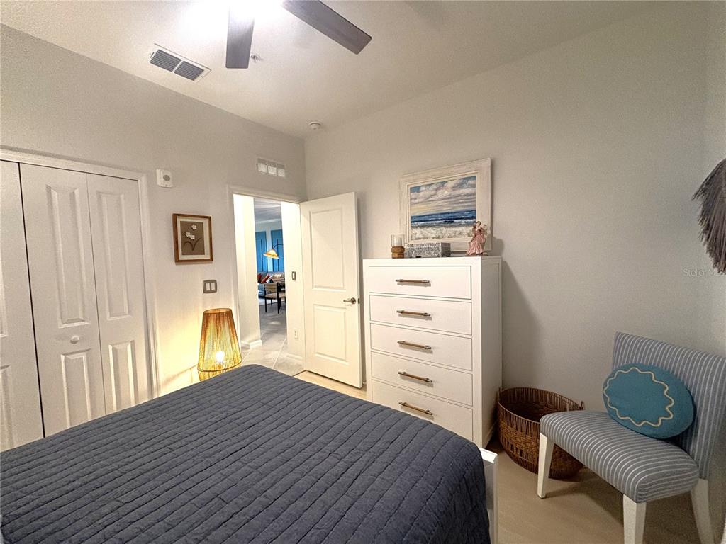 12140 Wellen Golf Street, Unit 404 Venice, FL 34293 - Photo 25 of 55 a bedroom with a bed and furniture