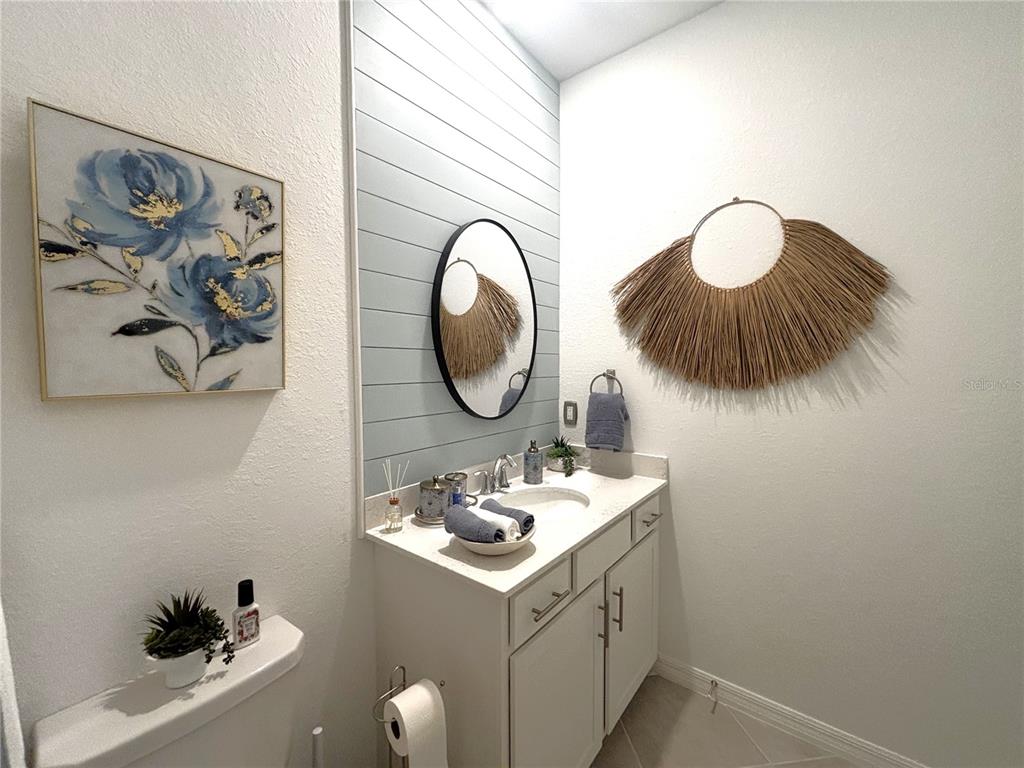 12140 Wellen Golf Street, Unit 404 Venice, FL 34293 - Photo 27 of 55 a bathroom with a sink and a mirror