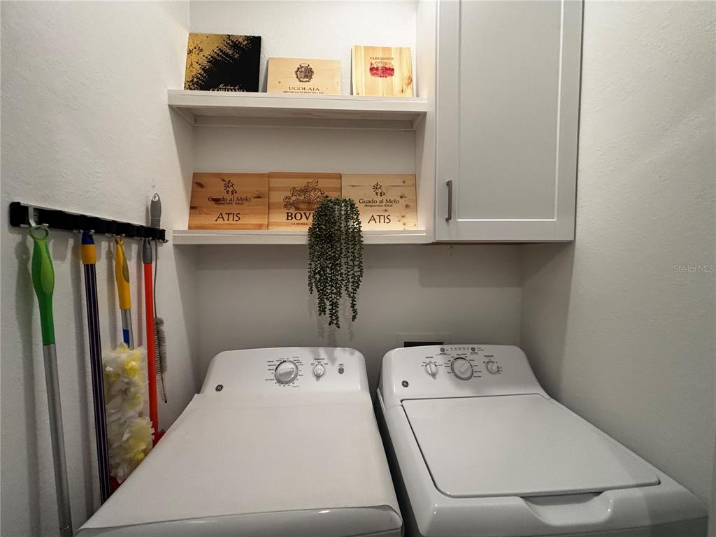 12140 Wellen Golf Street, Unit 404 Venice, FL 34293 - Photo 28 of 55 a utility room with dryer and washer