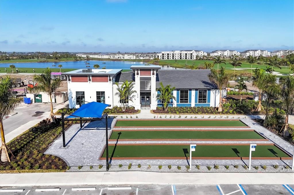 12140 Wellen Golf Street, Unit 404 Venice, FL 34293 - Photo 51 of 55 a front view of house with outdoor space and seating