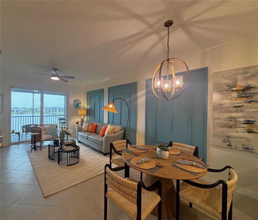 12140 Wellen Golf Street, Unit 404 Venice, FL 34293 - Photo 10 of 55 a view of a dining room with furniture wooden floor and chandelier