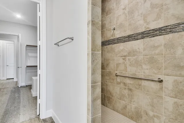a bathroom with a glass shower door