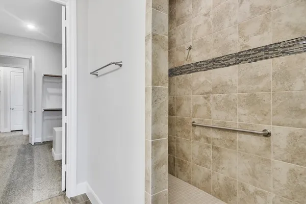 a bathroom with a glass shower door