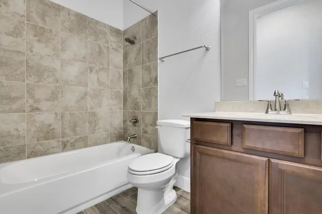 a bathroom with a sink toilet and bathtub