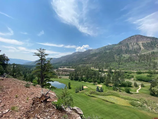 a view of a town with mountains in the background