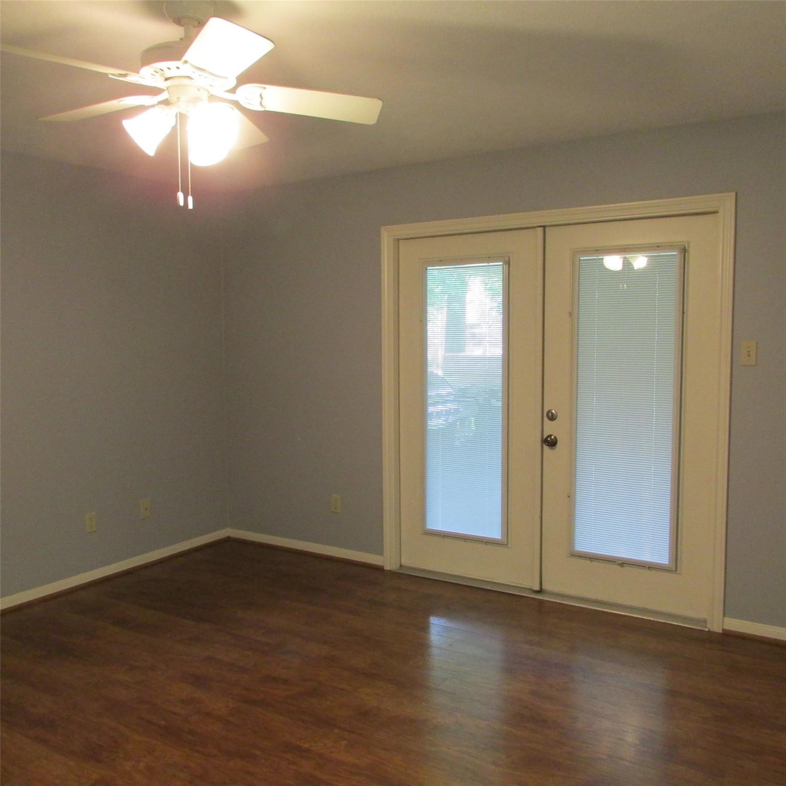 2232 Azalea Circle Huntsville, TX 77340 - Photo 10 of 24 Primary bedroom. French doors leading to covered back porch