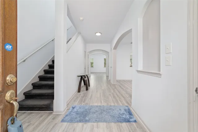 a view of entryway with wooden floor