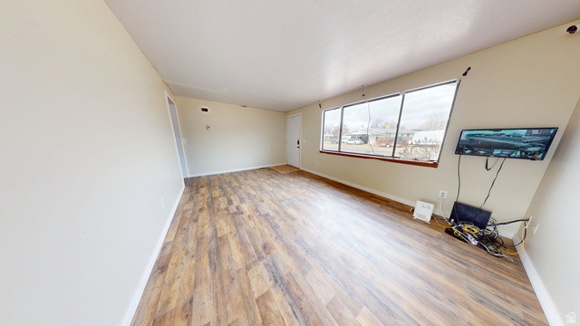 1348 Sagewood Road Price, UT 84501 - Photo 4 of 34 Unfurnished room with baseboards and light wood finished floors