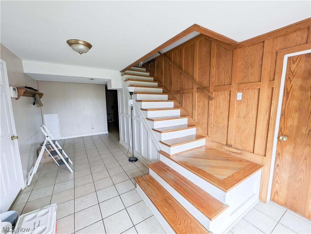 8635 Ridgley Road Mount Perry, OH 43760 - Photo 9 of 11 Stairway featuring light tile floors