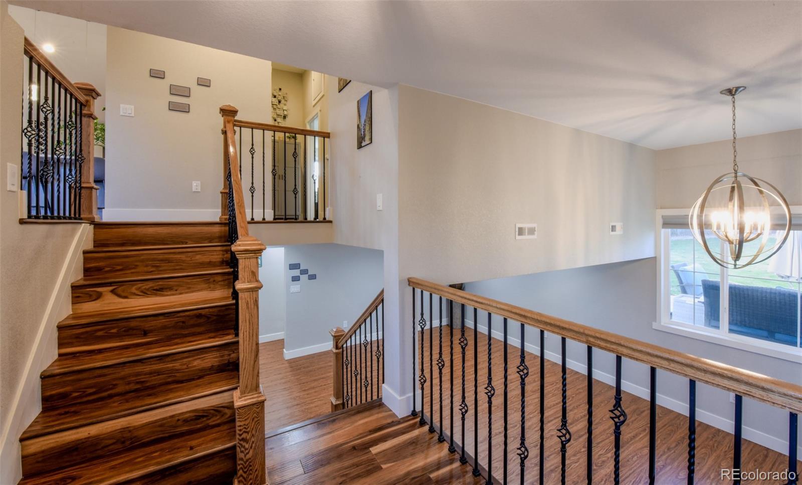 5389 West Roxbury Place Littleton, CO 80128 - Photo 15 of 31 a view of entryway and hall with wooden floor