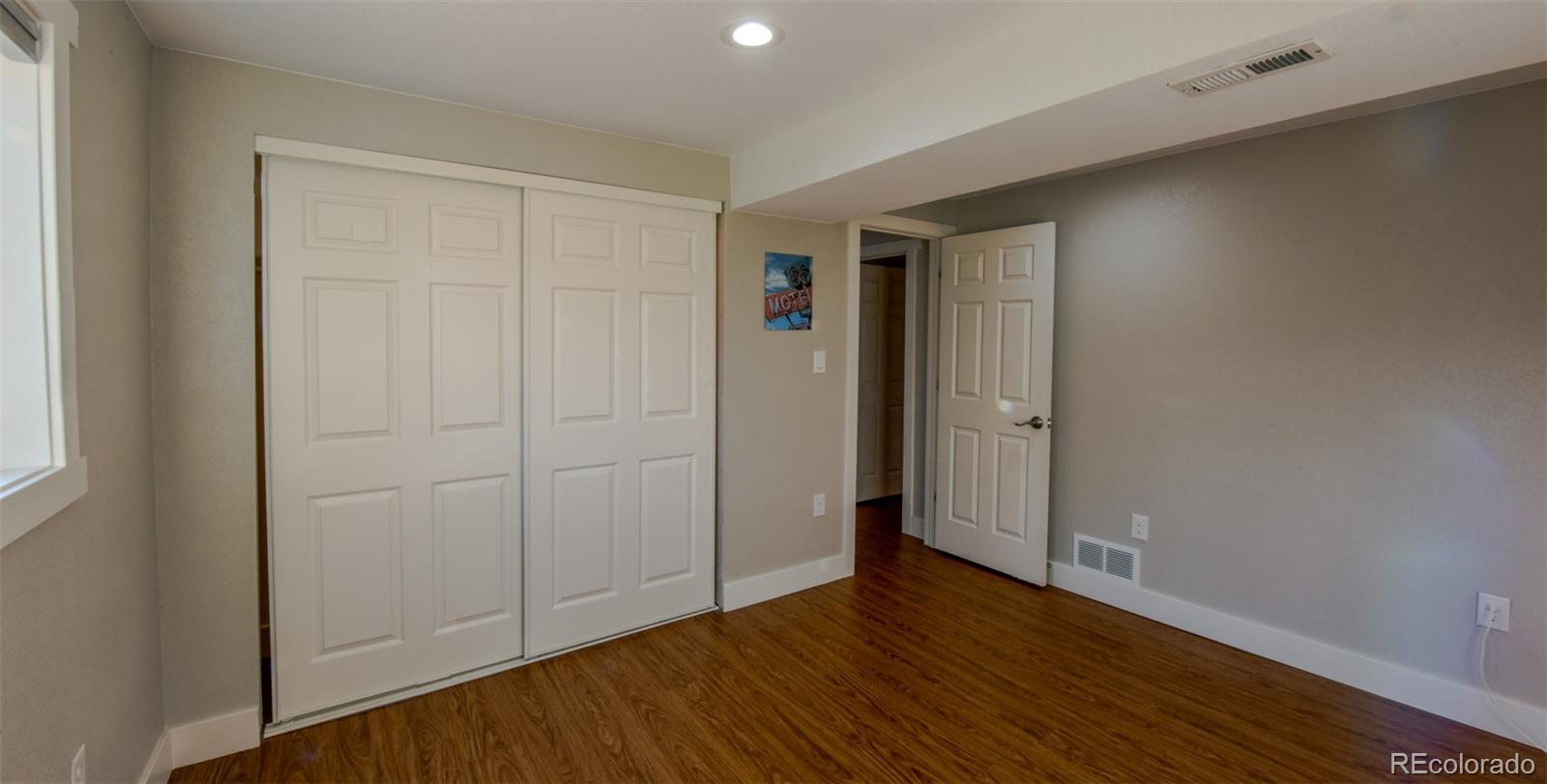 5389 West Roxbury Place Littleton, CO 80128 - Photo 20 of 31 wooden floor in an empty room
