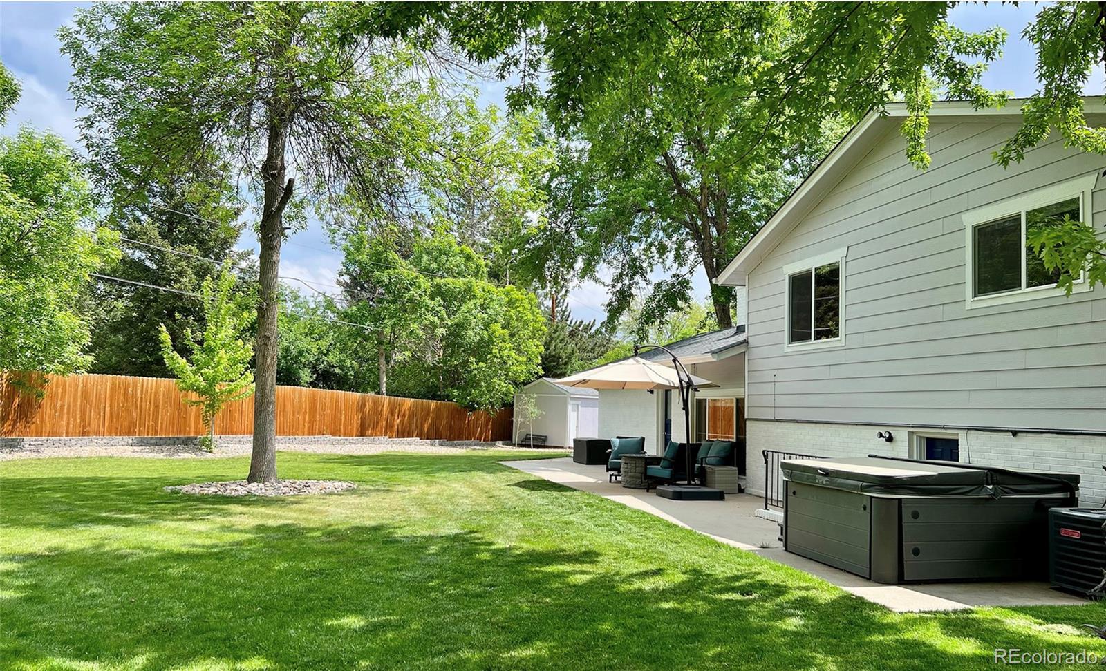5389 West Roxbury Place Littleton, CO 80128 - Photo 24 of 31 a view of a house with backyard and sitting area