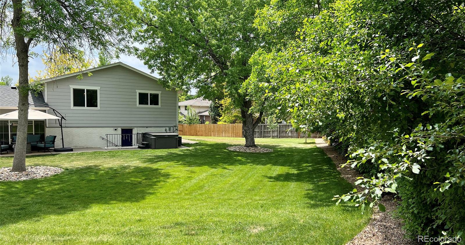 5389 West Roxbury Place Littleton, CO 80128 - Photo 26 of 31 a view of a house with a yard