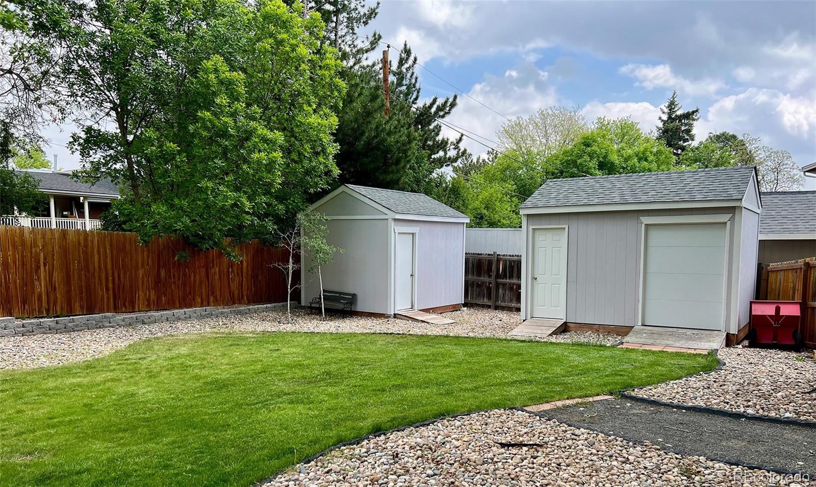 5389 West Roxbury Place Littleton, CO 80128 - Photo 28 of 31 a front view of a house with garden